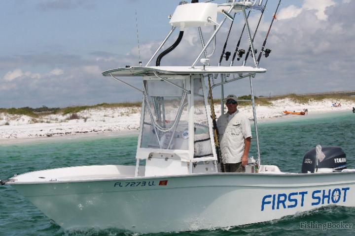 small boat with captain on water