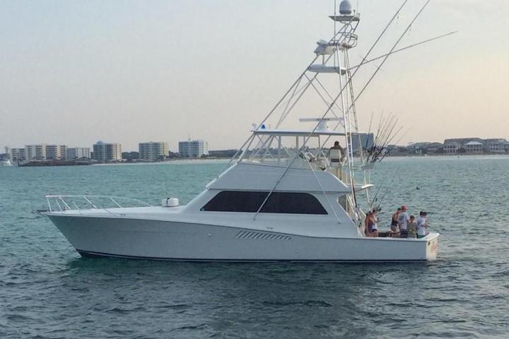 people on back of boat on water