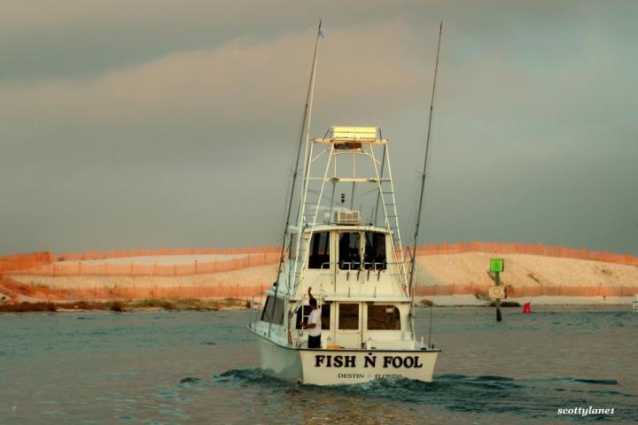 Fish N Fool boat heading toward shore